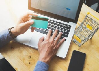 Shopping online use credit card to pay online.Vintage tone, Retro filter effect. Business online shopping and sale concept .